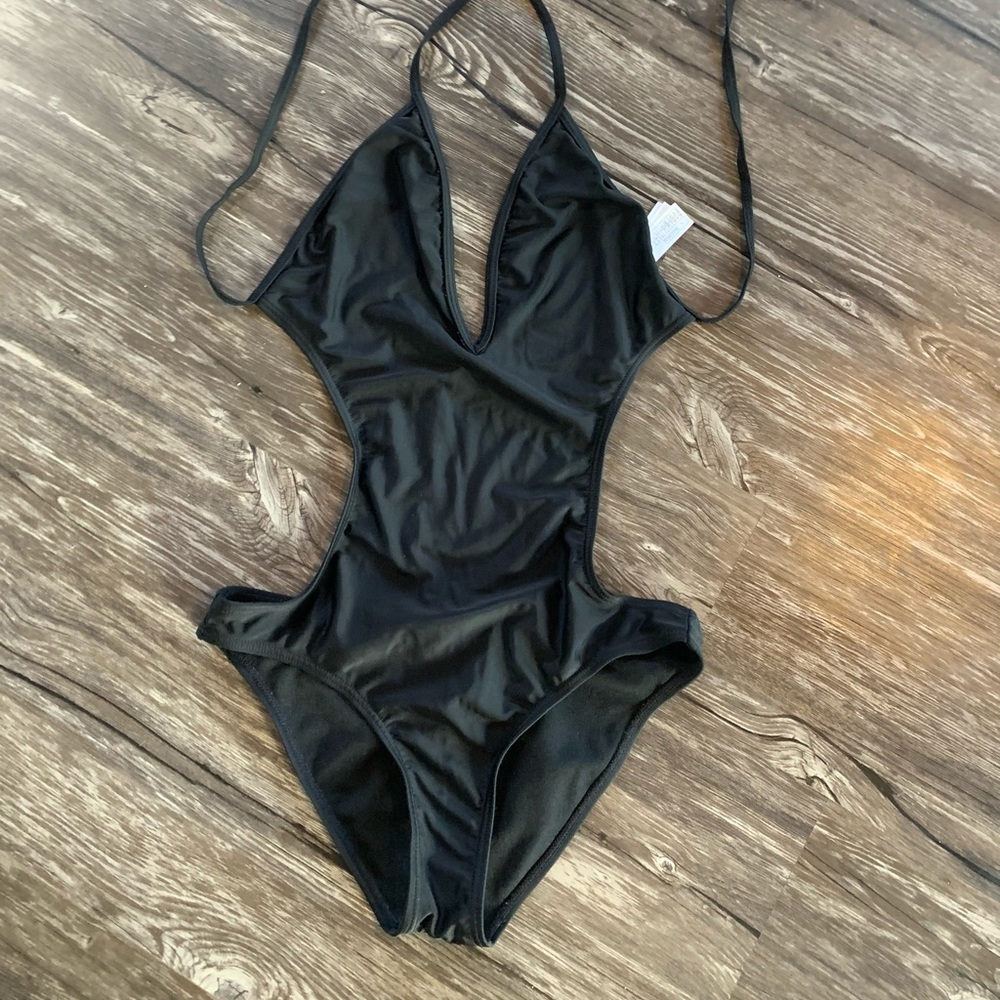 Black one piece size small new never worn